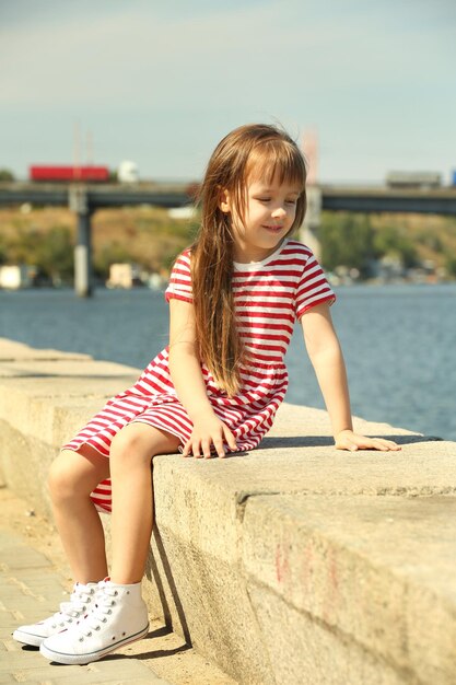 Little girl on the riverside