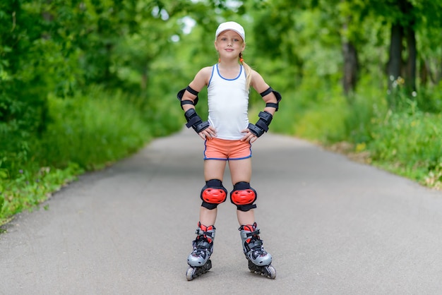 Little girl in roller skates at a park