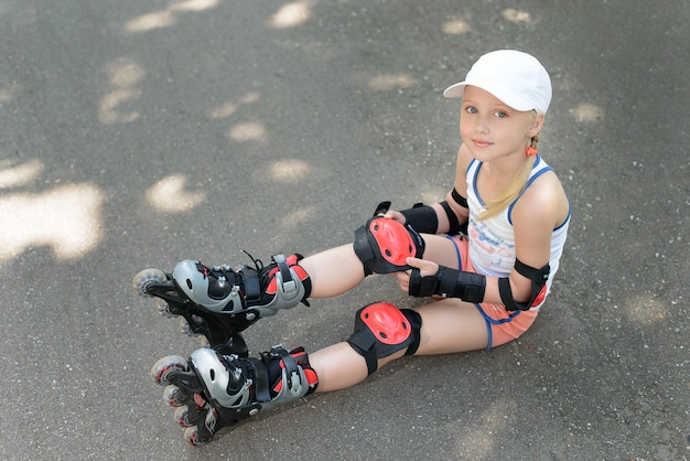 Little girl in roller skates at a park