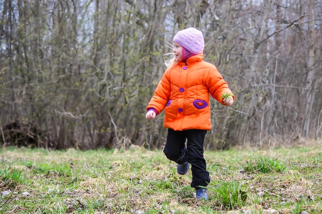 Little girl running on meadow