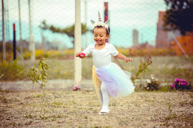 Little girl running in the yard