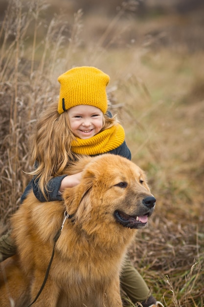 Little girl saddled up a big shaggy dog 9767