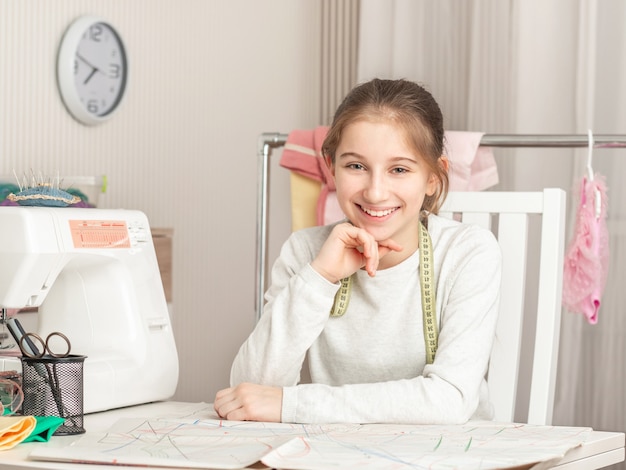 Little girl in a sewing workshop