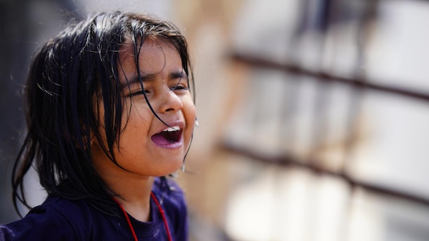 A little girl shouting face close up image