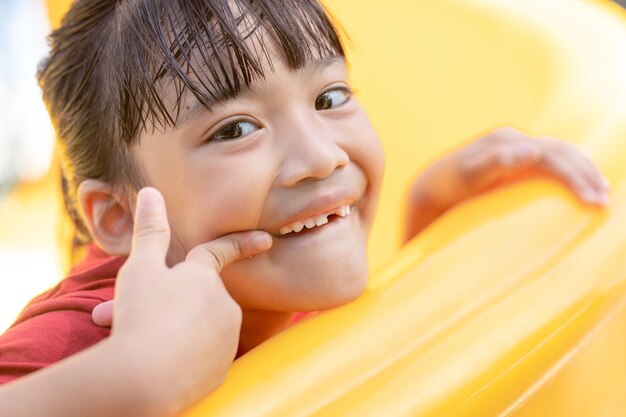 Little girl showing her broken milk teeth