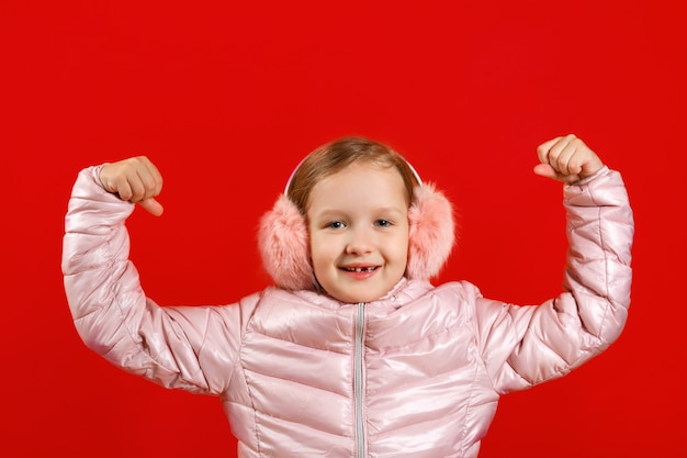 Little girl shows strong hands.