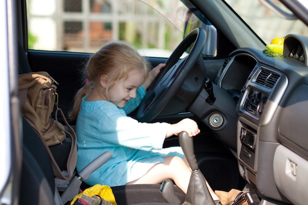 Little girl sitting in the car