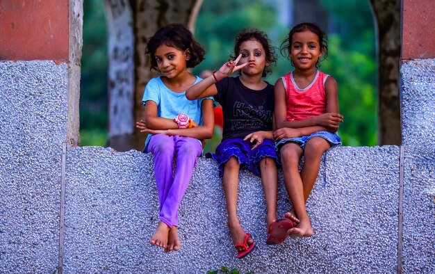 Little girl sitting together image