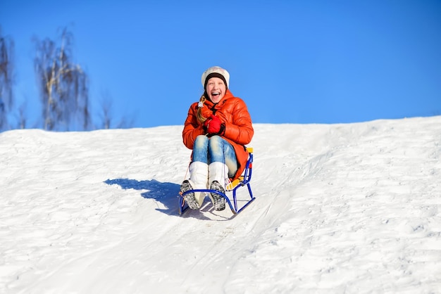 Little girl on sleigh winter