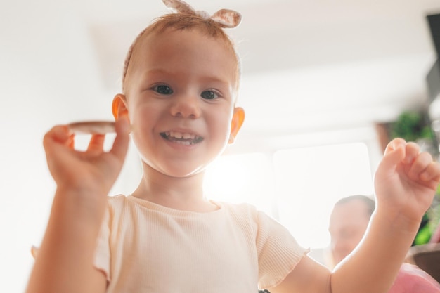 Little girl smiling in the living room at home