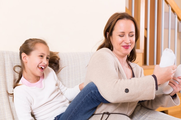 Little girl and smiling mom