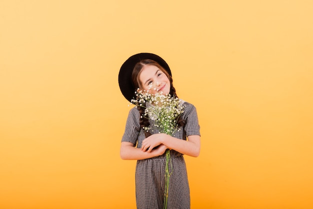 Little girl standing on yellow