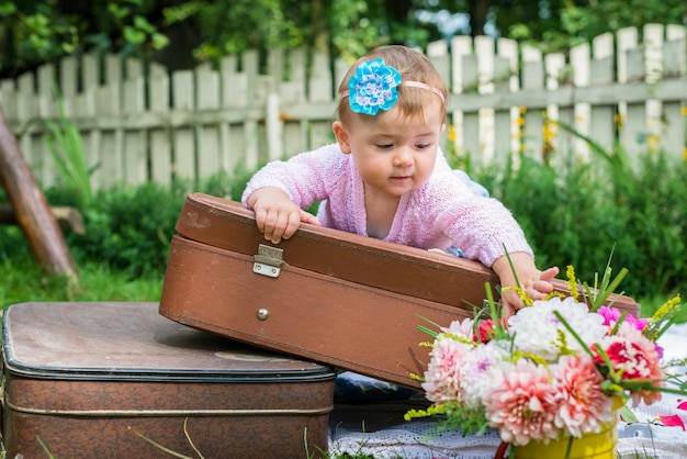 Little girl on suitcase