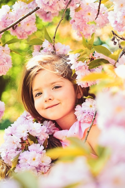 Little girl in sunny spring Summer girl fashion Happy childhood Springtime weather forecast face and skincare allergy to flowers Small child Natural beauty Childrens day Summer camp