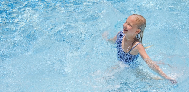 Little girl in swimming pool