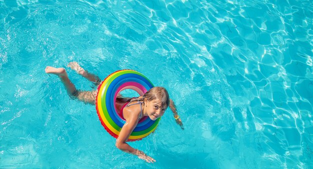 A little girl swimming in the pool