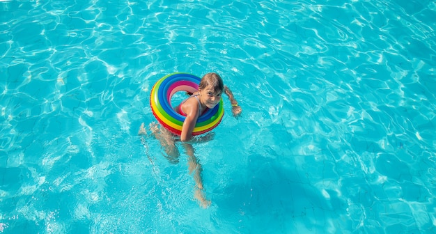 A little girl swimming in the pool