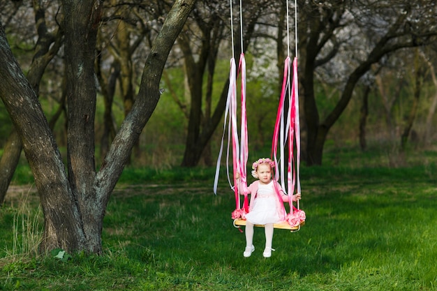 Little girl on the swing, little girl at park, cute little girl, little girl