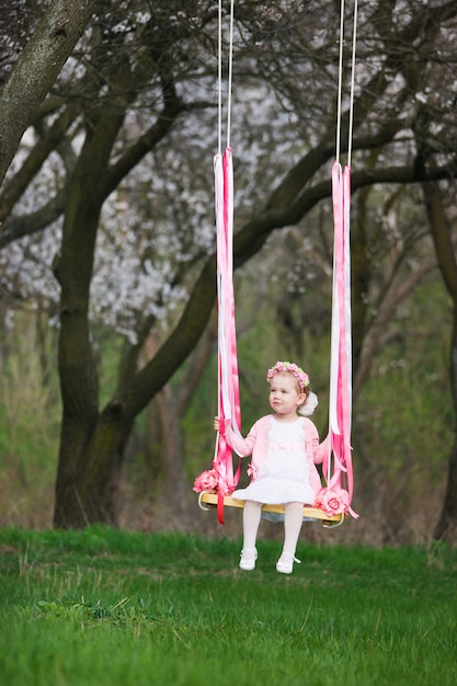 Little girl on the swing, little girl at park, cute little girl, little girl
