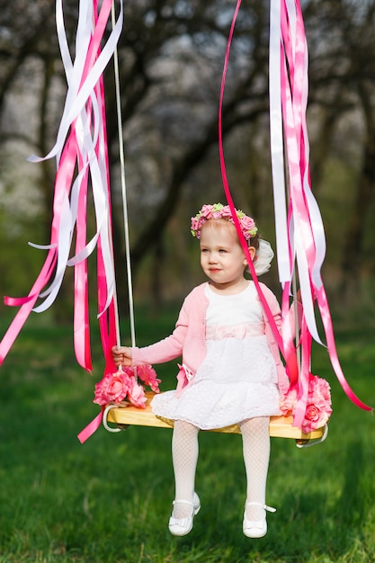 Little girl on swing, little girl at park