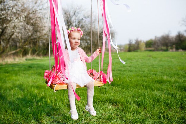 Little girl on the swing, little girl at park