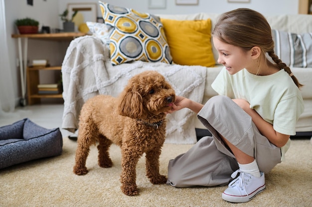 Little girl talking to her pet