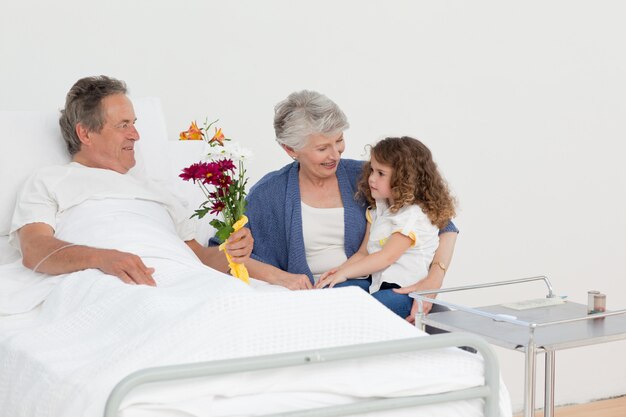 A little girl talking  with her grandparents