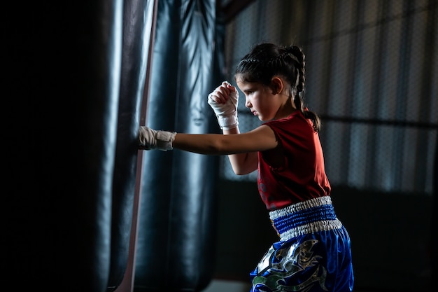 Little girl Thai boxing training is a self defense course, Muay Thai.