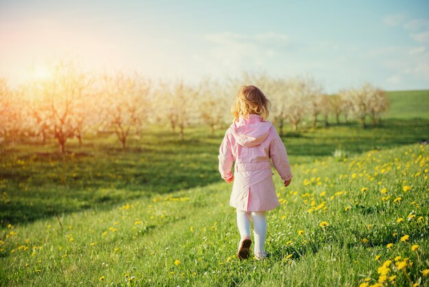 The little girl that runs in spring sunny day. Art processing an