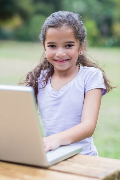 Little girl using her laptop