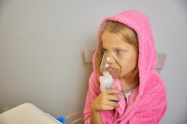 Little girl using inhaler respiratory problems