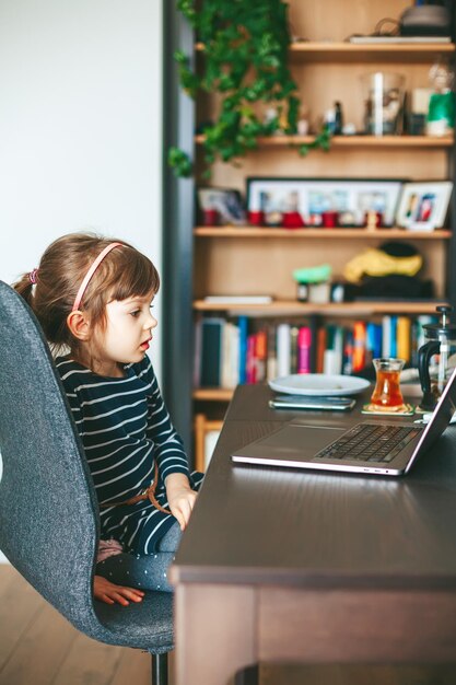 Little girl using a laptop