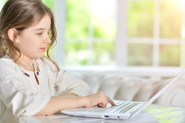 Little girl using laptop