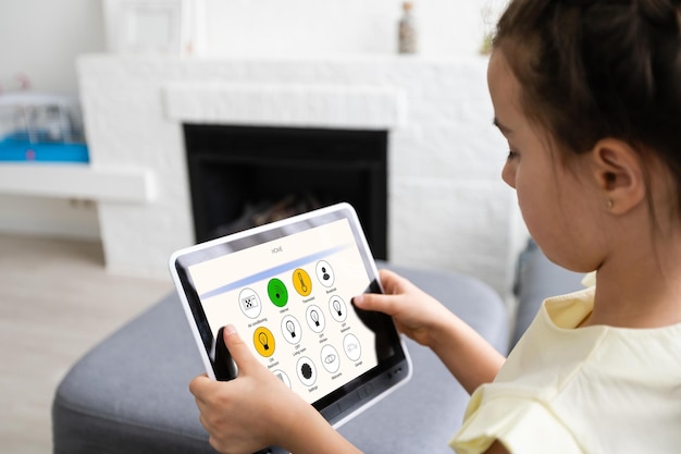 little girl using tablet with home remote control , living room in background, smart home