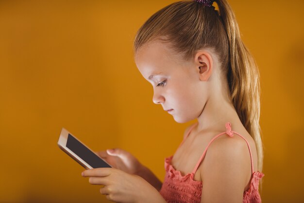 Little girl using a tablet