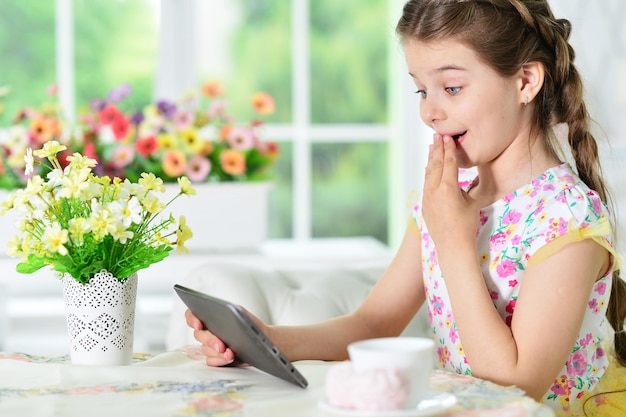 Little girl using tablet