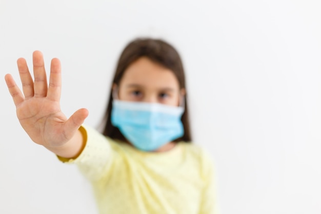 little girl wear mask on white background, A girl wearing protection medical mask covid-19 or coronavirus from Infected person, corona protected Help protect For world and people stop virus warning