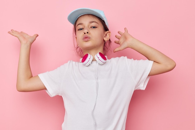 Little girl wearing headphones posing emotions isolated background