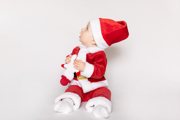 Little girl wearing santa claus costume