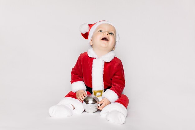 Little girl wearing santa claus costume