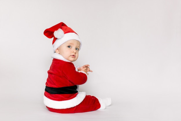 Little girl wearing santa claus costume