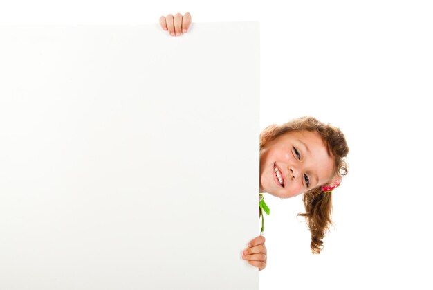 Little girl behind a white board