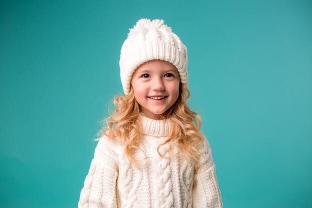 little girl in winter knitted hat and sweater