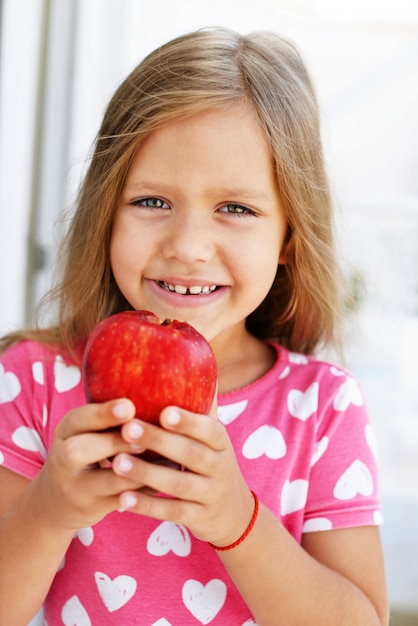 Little girl with an apple