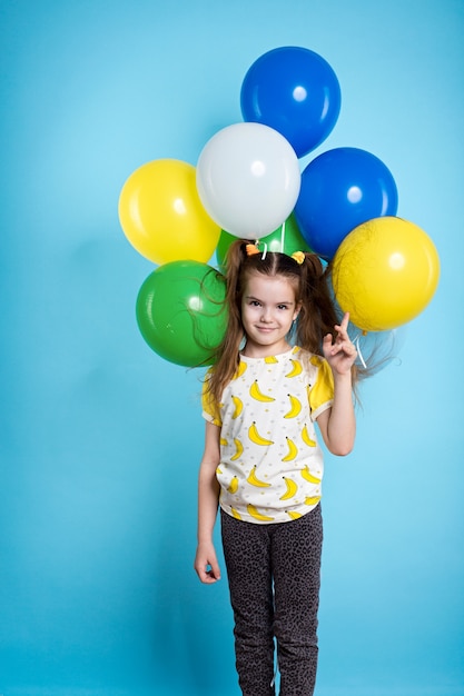 Little girl with balloons