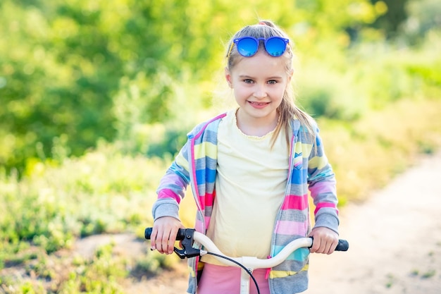 Little girl with bicycle