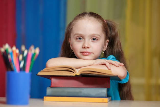 Little girl with books