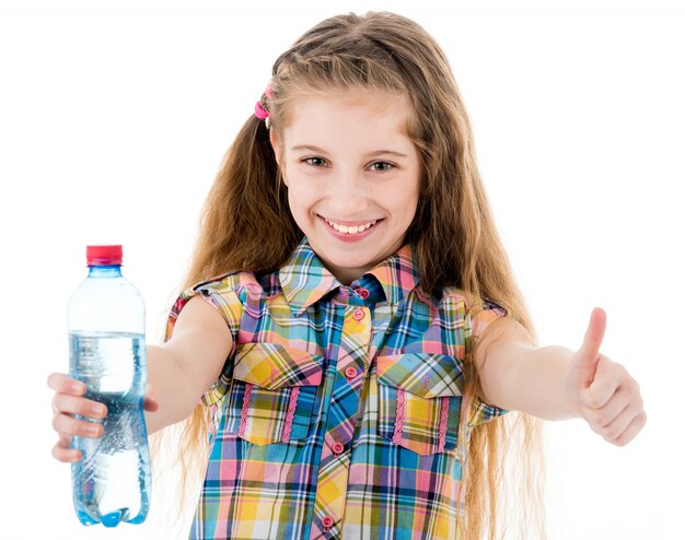 Little girl with bottle of water showing ok sign