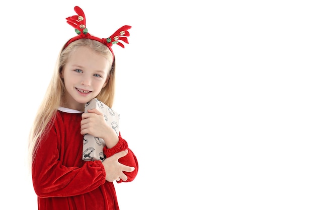 Little girl with Christmas box isolated on white background