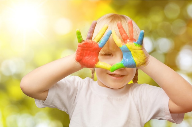 little girl with colorful painted hands